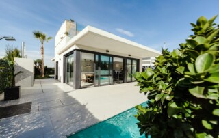 Modern white villa with patio and swimming pool