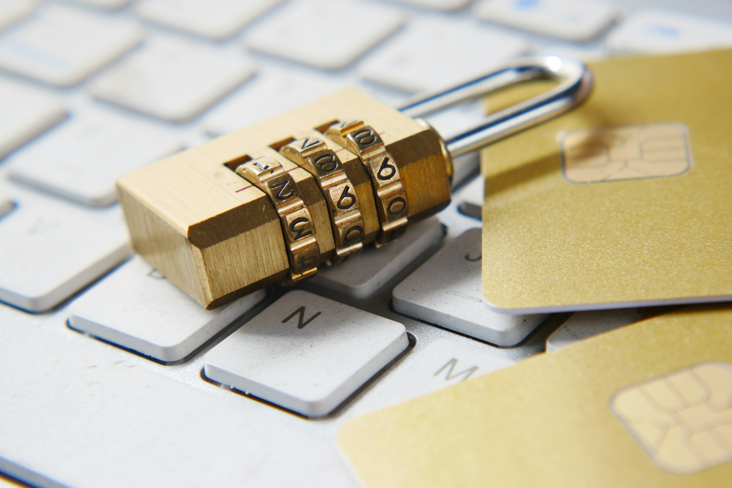 Combination padlock and credit cards on keyboard